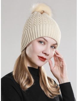 Knitted hat with pompons decor