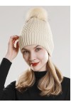 Knitted hat with pompons decor